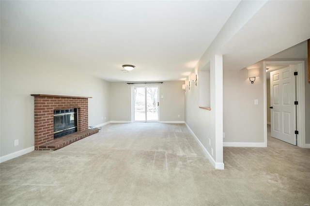 unfurnished living room featuring baseboards, carpet, and a brick fireplace