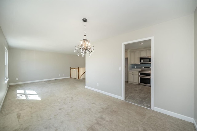 interior space with recessed lighting, baseboards, light carpet, and a chandelier