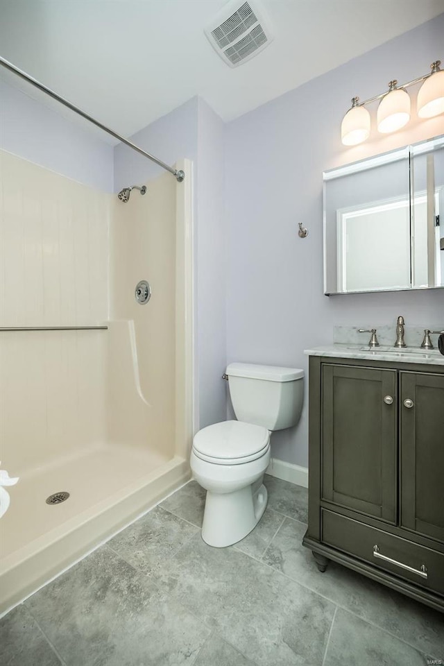 full bath featuring a shower, visible vents, toilet, and vanity