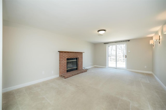 unfurnished living room featuring light carpet, a fireplace, and baseboards