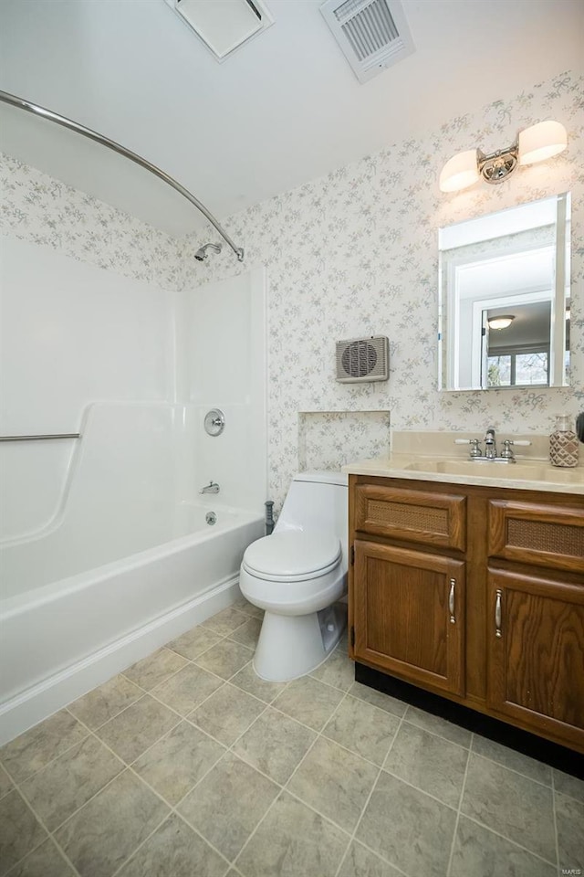 bathroom featuring vanity, visible vents, wallpapered walls, shower / bathing tub combination, and toilet