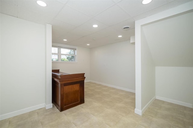 office space with recessed lighting, visible vents, and baseboards