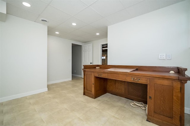 home office featuring baseboards, visible vents, built in study area, recessed lighting, and a drop ceiling