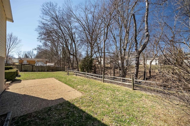 view of yard with a fenced backyard