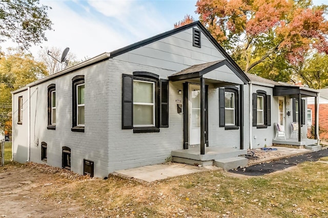 view of front of home featuring brick siding