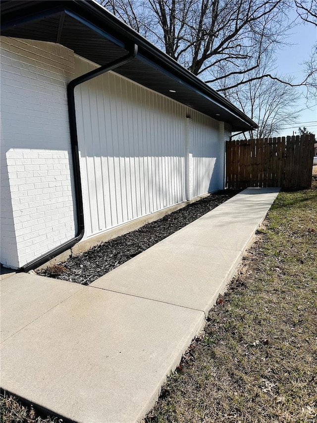 view of property exterior featuring fence