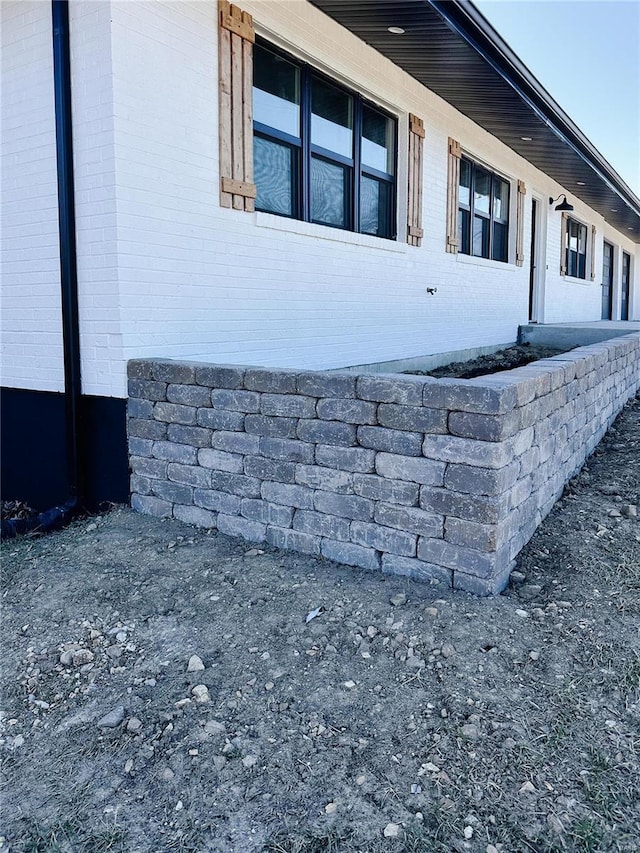 view of home's exterior with brick siding