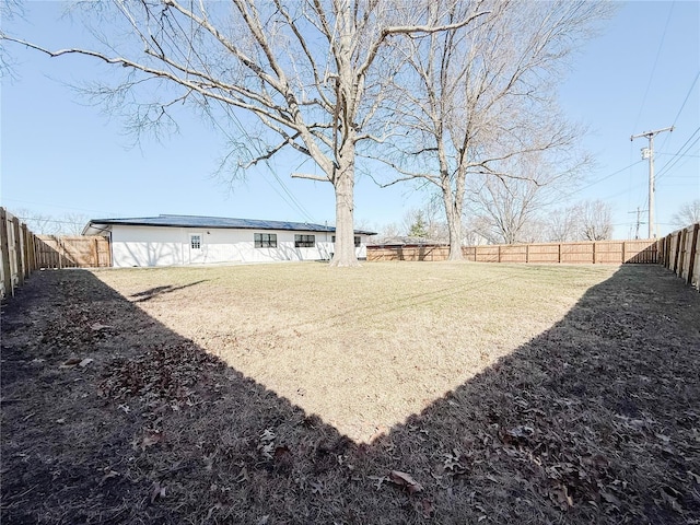 view of yard with a fenced backyard