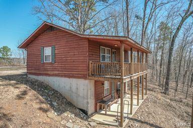 view of property exterior featuring a patio area