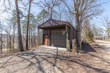 view of outbuilding with an outdoor structure and driveway