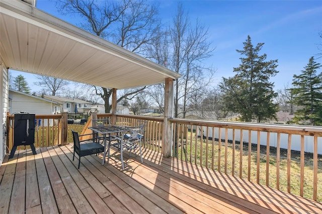 wooden deck featuring outdoor dining space