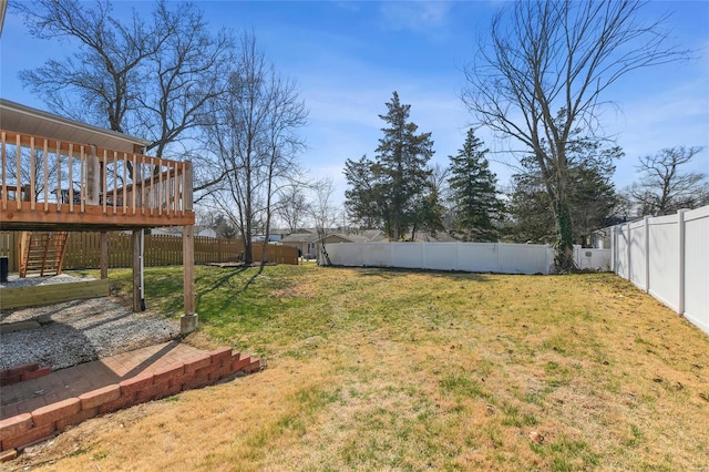 view of yard featuring a wooden deck, a fenced backyard, and stairway