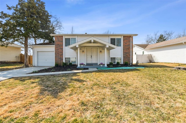 view of front of property with brick siding, a front lawn, fence, concrete driveway, and an attached garage