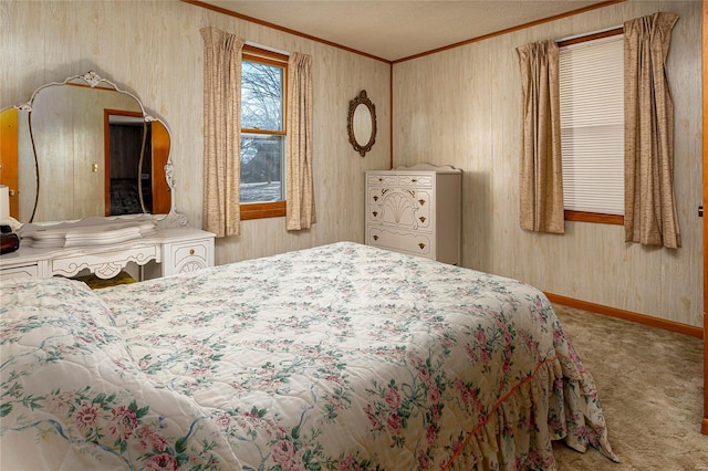 carpeted bedroom with baseboards and ornamental molding