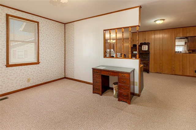 unfurnished office with ornamental molding, wallpapered walls, baseboards, and carpet floors