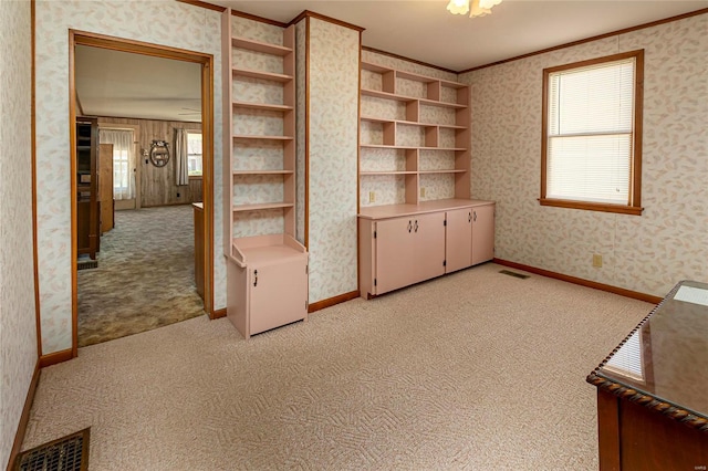 interior space featuring light carpet, visible vents, wallpapered walls, and ornamental molding