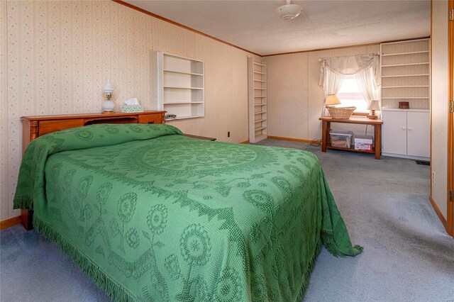 carpeted bedroom featuring visible vents, baseboards, crown molding, and wallpapered walls