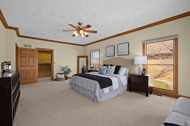 bedroom with visible vents, light carpet, baseboards, and ornamental molding