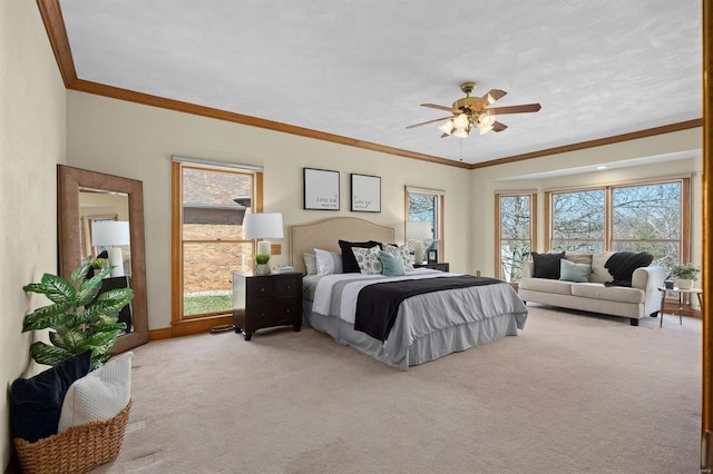 bedroom with ornamental molding, multiple windows, baseboards, and light carpet