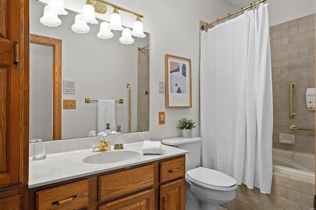 bathroom with vanity, toilet, and shower / bath combo with shower curtain