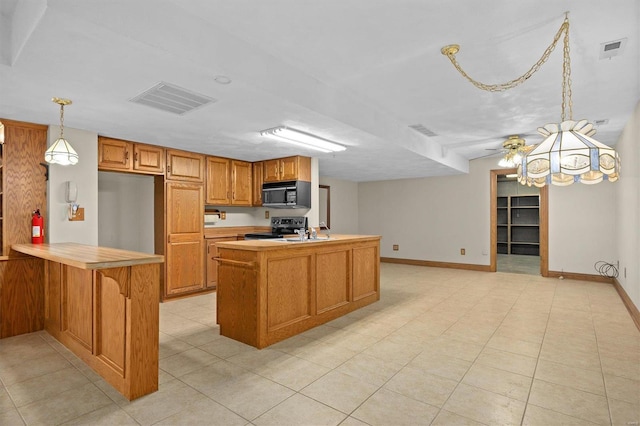 kitchen with visible vents, light countertops, electric stove, and black microwave