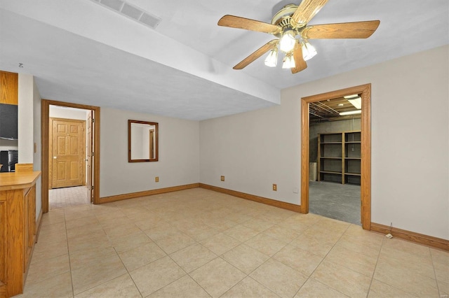 unfurnished room with a ceiling fan, light tile patterned floors, baseboards, and visible vents