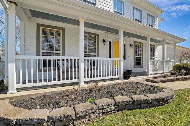 doorway to property with a porch