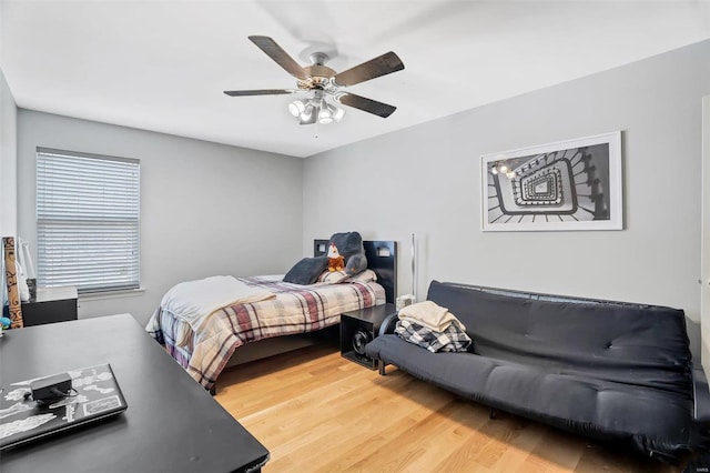 bedroom featuring light wood-style flooring and ceiling fan