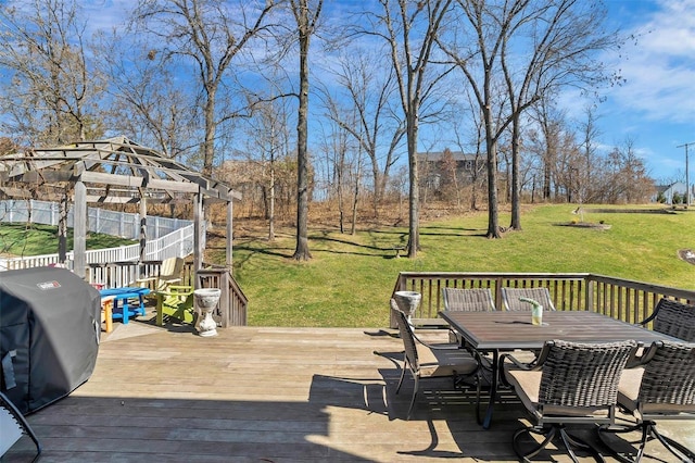 wooden deck with outdoor dining space, area for grilling, and a lawn