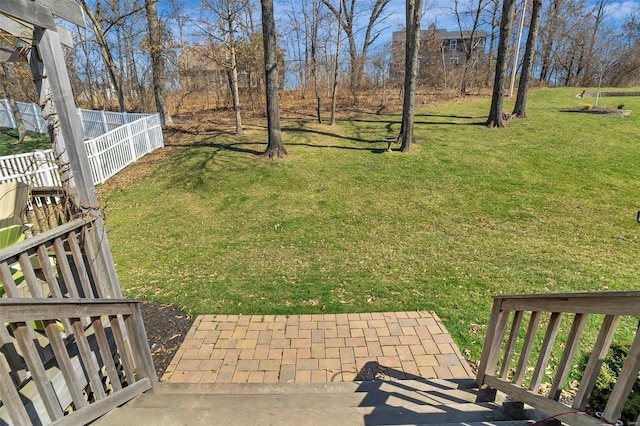 view of yard featuring a patio and fence