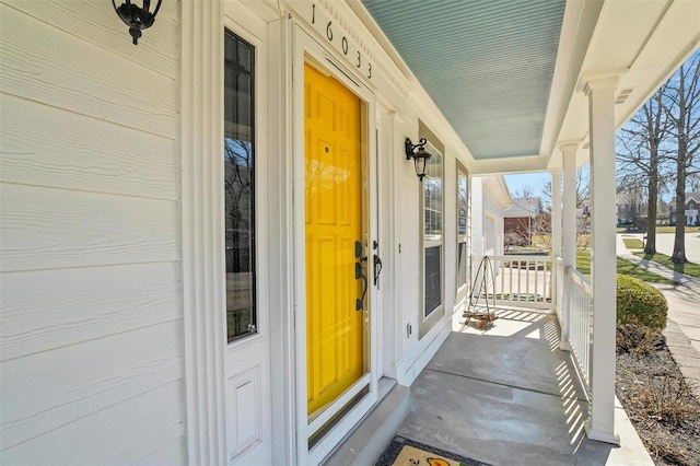 view of exterior entry featuring a porch