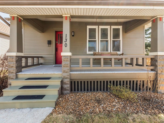 property entrance with covered porch