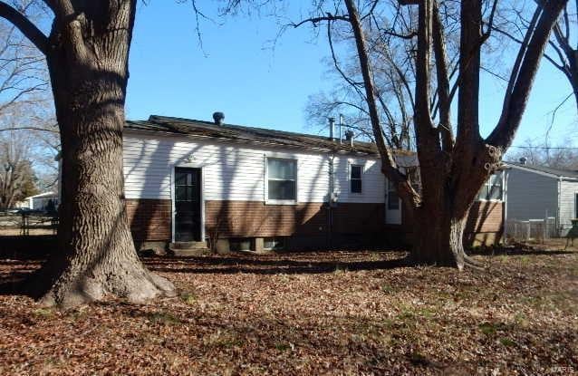 view of side of property with brick siding