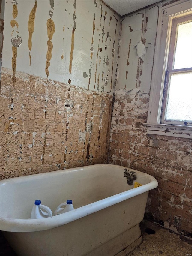 full bathroom with a freestanding tub