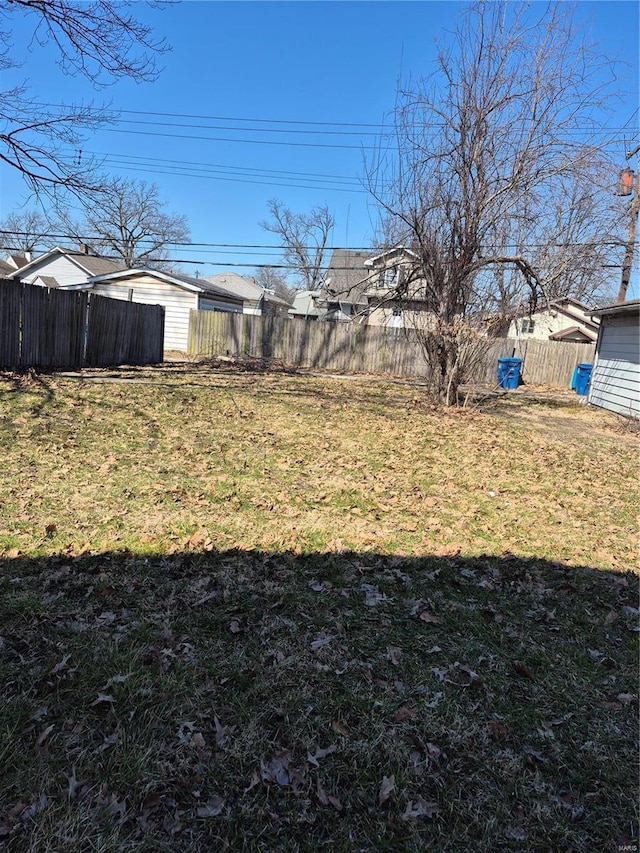 view of yard with a fenced backyard