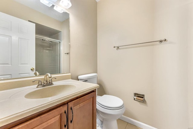 full bath with tile patterned floors, toilet, a stall shower, and vanity