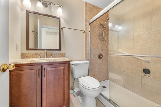 full bathroom featuring visible vents, toilet, vanity, and a tile shower