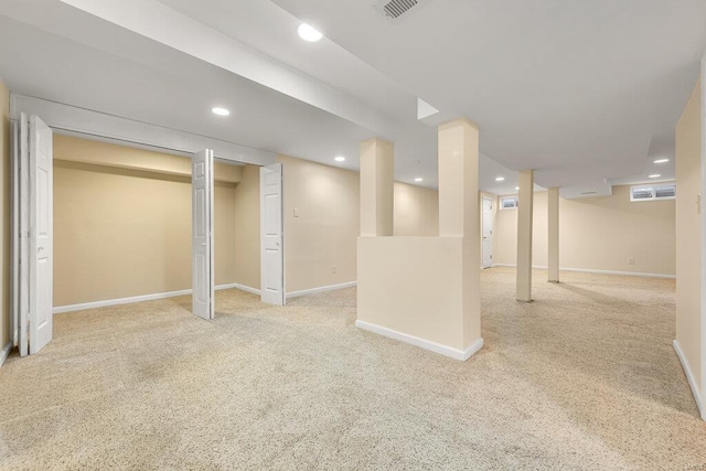 finished basement with recessed lighting, visible vents, baseboards, and carpet floors