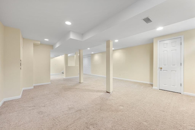 finished below grade area featuring recessed lighting, visible vents, baseboards, and carpet floors