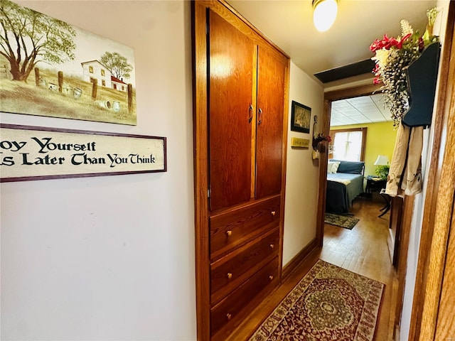 hall featuring wood finished floors