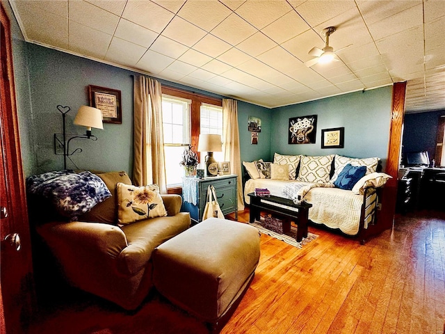 living room featuring a ceiling fan and hardwood / wood-style floors