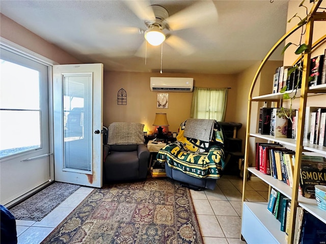 living area featuring light tile patterned floors, a ceiling fan, and a wall mounted AC