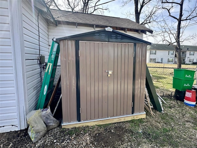 view of shed with fence