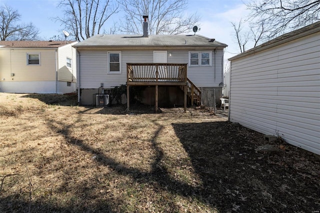 back of property featuring a wooden deck, cooling unit, and stairway