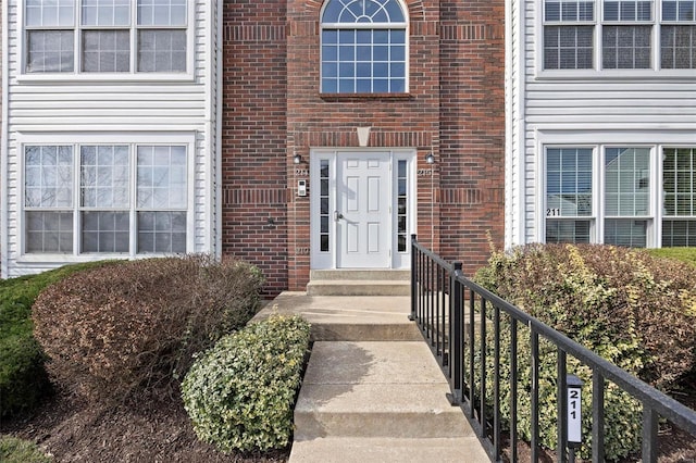 entrance to property with brick siding