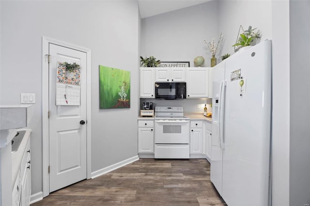 kitchen with dark wood-style floors, white appliances, white cabinets, light countertops, and baseboards