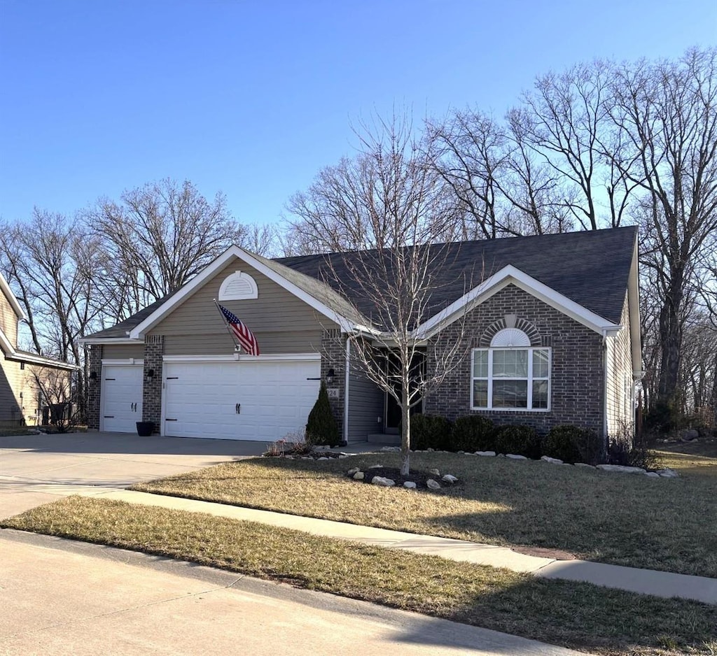 ranch-style home featuring a garage, brick siding, and driveway