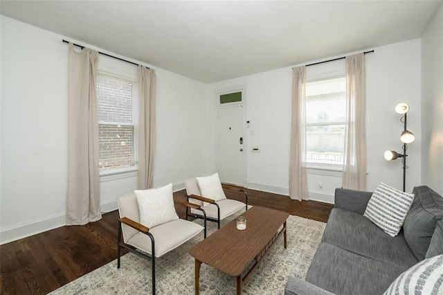 living room featuring wood finished floors and baseboards