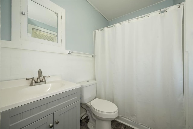 full bath with a shower with shower curtain, toilet, and vanity