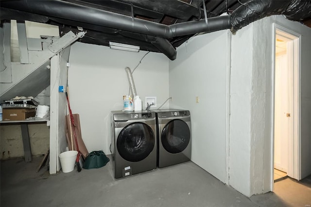 unfinished below grade area with washer and clothes dryer